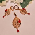 Mayura gold-plated festive pendant set with red teardrop stones