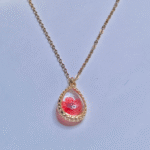 Gold Plated Minimalist Pendent, close up of red preserved flower in resin