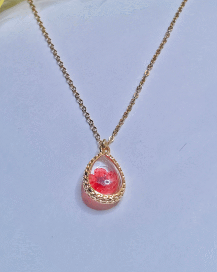 Gold Plated Minimalist Pendent, close up of red preserved flower in resin
